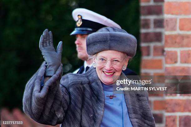 Queen Margrethe II of Denmark waves after visiting the tomb of her father, Frederick IX of Denmark, at Roskilde Cathedral on the day of Queen's 50th...