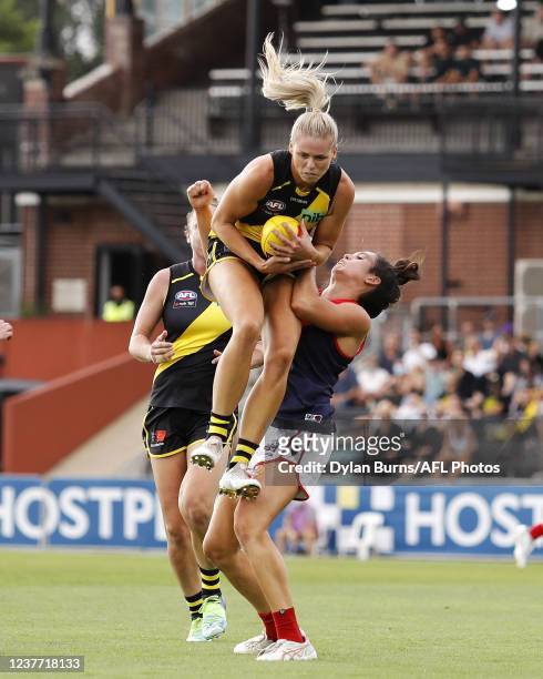 Katie Brennan of the Tigers marks the ball ahead of Gabrielle Colvin of the Demons during the 2022 AFLW Round 02 match between the Richmond Tigers...