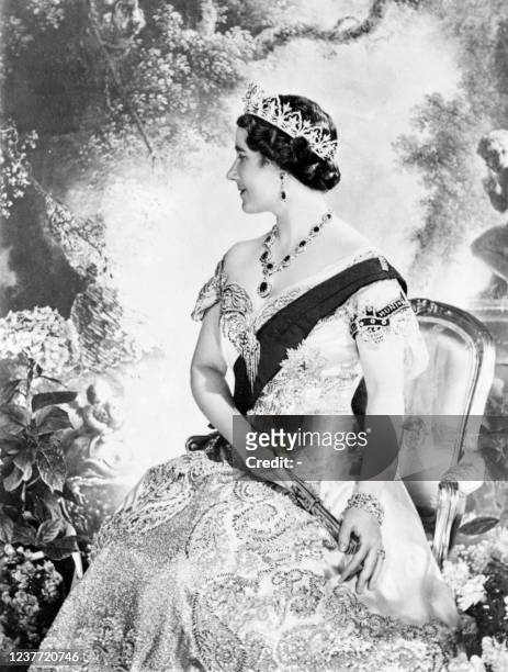 Queen Elizabeth, the former Duchess of York smiles as she poses in 1937 for official picture in London after the Coronation 12 May 1937 of the Duke...