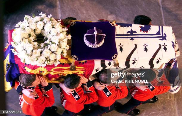 An overhead view of the coffin of Queen Elizabeth, the Queen Mother as it is carried into Westminster Hall Friday April 5, 2002 by soldiers of the...