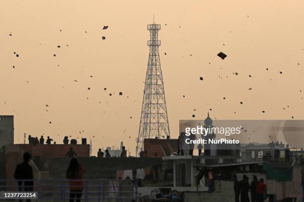 People fly kites on the occasion of Makar Sankranti Festival , at Walled city area in Jaipur, Rajasthan , India, Jan 14,2022.