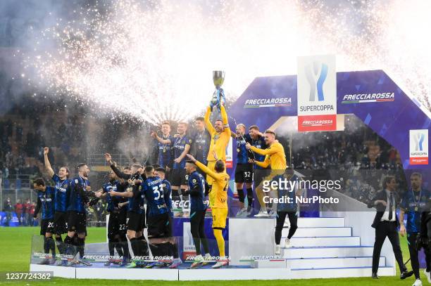 Samir Handanovic of FC Internazionale rises up the trophy with his teammates winning the Italian SuperCup Final match between FC Internazionale and...