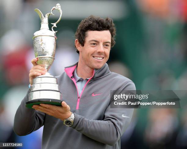 Rory McIlroy of Northern Ireland celebrates with the trophy after his two-stroke victory in the 143rd Open Championship at Royal Liverpool Golf Club...