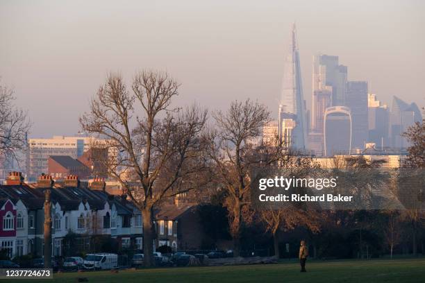 On the day that Londoners are being told to reduce physical activity on Friday due to pollution across the capital, distant skyscrapers including the...