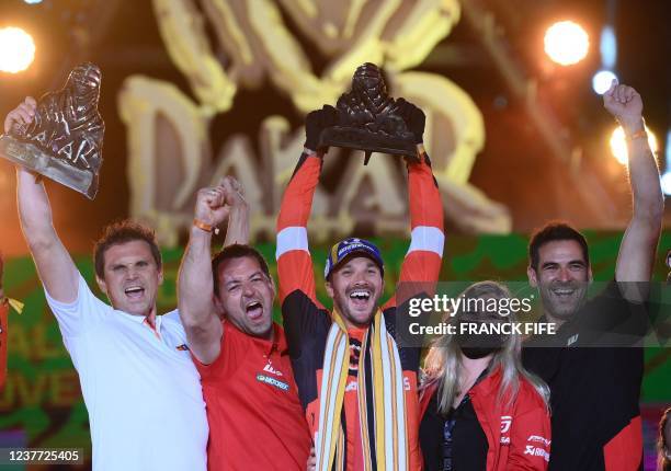 S British biker Sam Sunderland celebrates his win in the Dakar 2022 Rally on the podium in Saudi Arabia's Red Sea coastal city of Jeddah, on January...