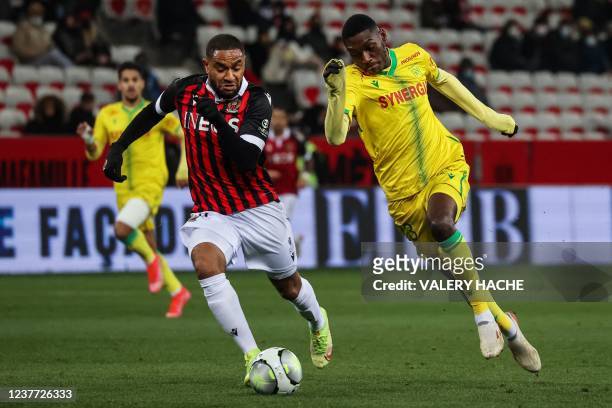 Nantes' Congolese forward Randal Kolo Muani fights for the ball with Nice's French defender Jordan Amavi the French L1 football match between OGC...