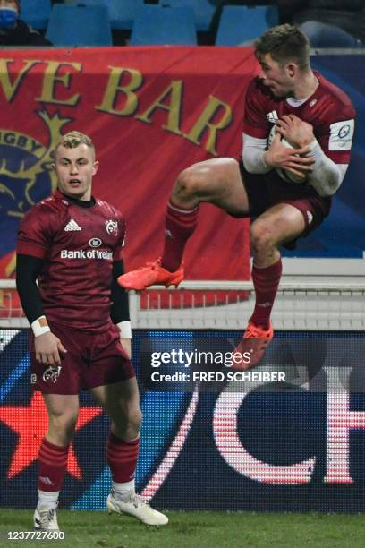 Munster's Irish fly-half Jack Crowley catches the ball during the European Champions Cup Round 3 Pool B rugby union match between Castres Olympique...