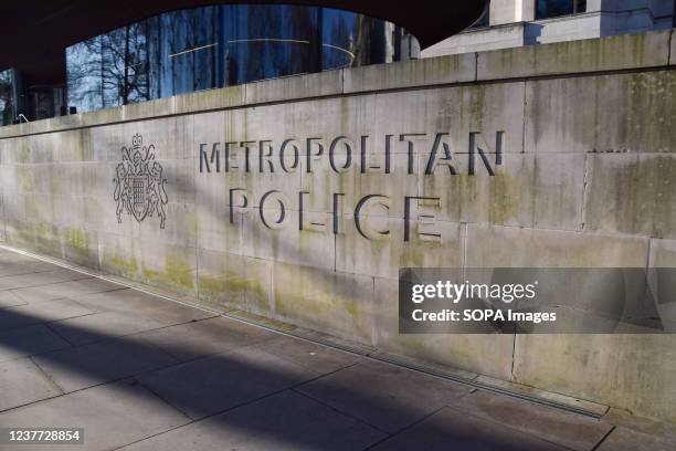 Metropolitan Police sign is seen outside the New Scotland Yard building in Westminster, London.