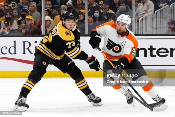 Boston Bruins right defenseman Charlie McAvoy ties up Philadelphia Flyers defenseman Ivan Provorov during a game between the Boston Bruins and the...