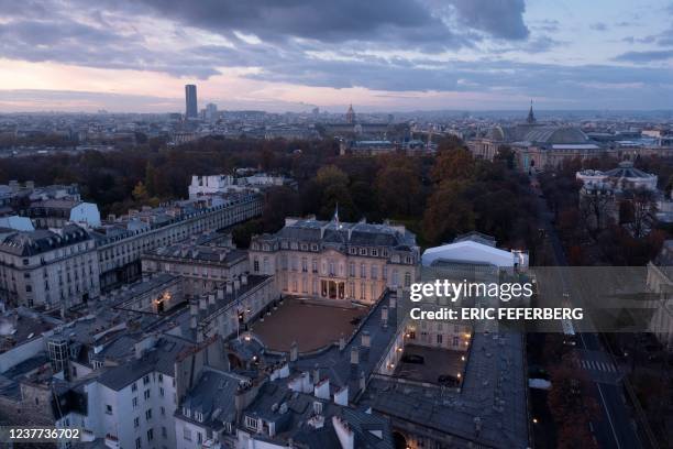 An aerial picture taken in Paris on November 12, 2019 shows the Elysee palace at the sunset time. - The Elysee Palace contains the presidential...