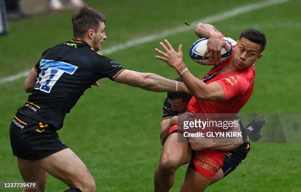 Toulouse's Tim Nanai-Williams is tackled during the European Rugby Champions Cup pool B rugby union match between Wasps and Toulouse at The Coventry...