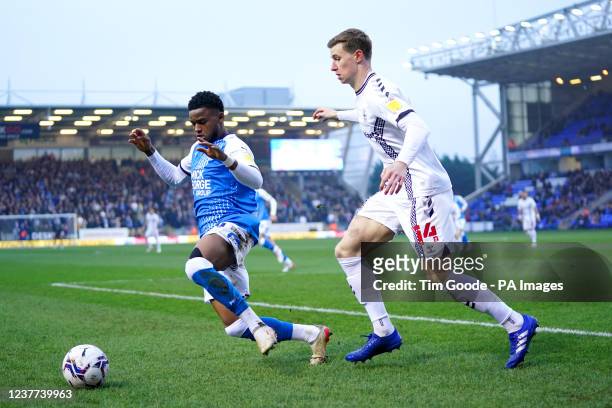 Coventry City's Ben Sheaf and Peterborough United's Bali Mumba battle for the ball during the Sky Bet Championship match at the Weston Homes Stadium,...