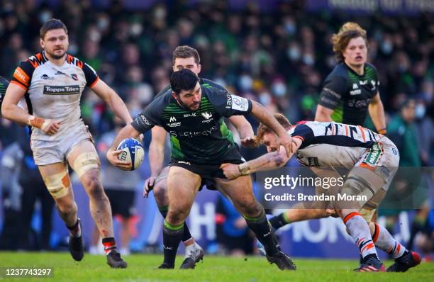 Galway , Ireland - 15 January 2022; Matthew Burke of Connacht is tackled by Ollie Chessum of Leicester Tigers during the Heineken Champions Cup Pool...