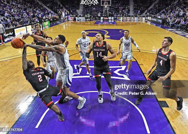 Davion Bradford of the Kansas State Wildcats blocks the shot of Davion Warren of the Texas Tech Red Raiders, during the second half at Bramlage...