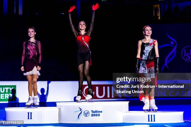 Gold medal winner Kamila Valieva of Russia, silver medal winner Anna Scherbakova of Russia and bronze medal winner Alexandra Trusova of Russia pose...