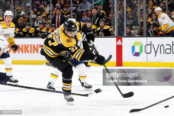 Boston Bruins center Patrice Bergeron shoots during a game between the Boston Bruins and the Nashville Predators on January 15 at TD Garden in...