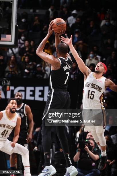 Kevin Durant of the Brooklyn Nets shoots a three point basket buzzer beater during the first period of the game against the New Orleans Pelicans on...