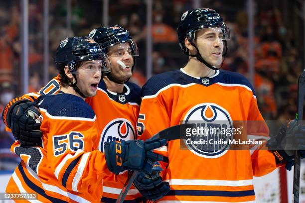 Kailer Yamamoto, Derek Ryan and Evan Bouchard of the Edmonton Oilers celebrate a goal against the Ottawa Senators during the second period at Rogers...