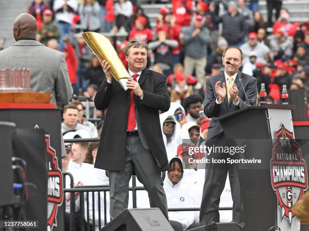 Georgia Bulldogs Head Coach Kirby Smart holds the College Football Playoff National Championship trophy during the Georgia Bulldogs National...