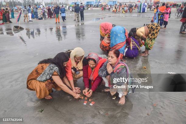 Devotees seen performing rituals and offering prayers during the celebration. Gangasagar is a place of Hindu pilgrimage where each year on the day of...