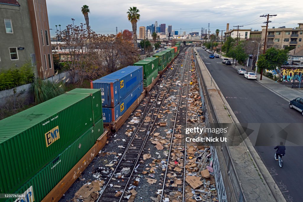 Trackside Clutter Train Packaging debris and items stolen from rail cars litter train tracks ...