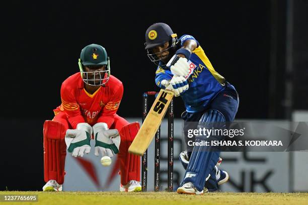 Sri Lanka's Pathum Nissanka plays a shot as Zimbabwe's wicketkeeper Regis Chakabva watches during the first one-day international cricket match...