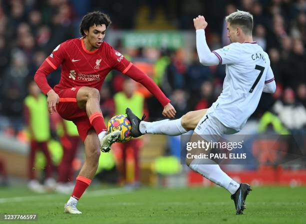 Liverpool's English defender Trent Alexander-Arnold vies with Brentford's Spanish striker Sergi Canos during the English Premier League football...