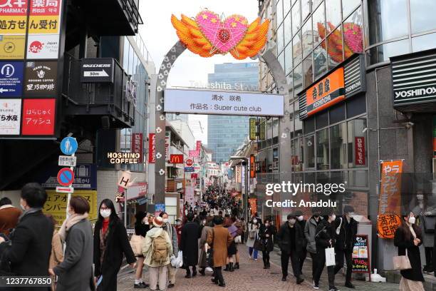 Local and foreign tourists walk about at Takeshita Street, where ornaments representing the "Harajuku" fashion defined by the word "kawaaii" are...
