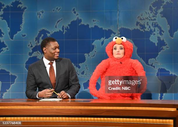 Ariana DeBose, Bleachers Episode 1815 -- Pictured: Anchor Michael Che and Chloe Fineman as Elmo during Weekend Update on Saturday, January 15, 2022 --
