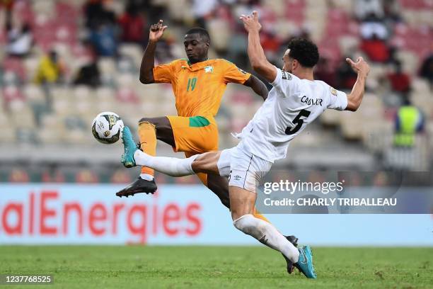 Ivory Coast's forward Nicolas Pepe fights for the ball with Sierra Leone's defender Steven Caulker during the Group E Africa Cup of Nations 2021...