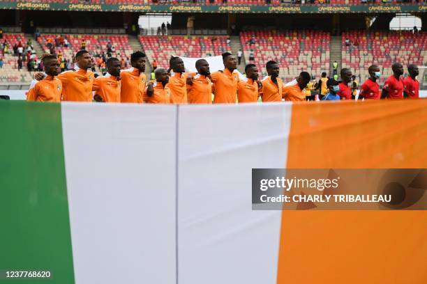 The Ivory Coast team sing their national anthem during the Group E Africa Cup of Nations 2021 football match between Ivory Coast and Sierra Leone at...