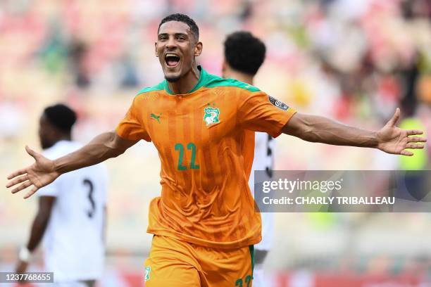 Ivory Coast's forward Sebastien Haller celebrates scoring his team's first goal during the Group E Africa Cup of Nations 2021 football match between...