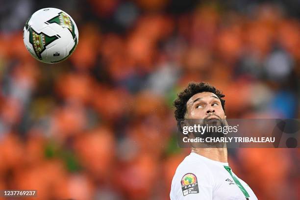 Sierra Leone's defender Steven Caulker heads the ball during the Group E Africa Cup of Nations 2021 football match between Ivory Coast and Sierra...