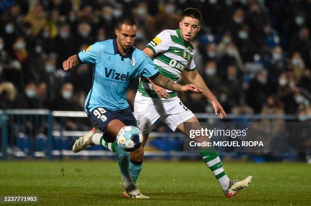 Vizela's Brazilian forward Guilherme vies with Sporting Lisbon's Portuguese defender Goncalo Inacio during the Portuguese league football match...