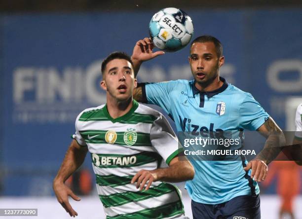 Sporting Lisbon's Portuguese defender Goncalo Inacio vies with FC Vizela's Brazilian forward Guilherme during the Portuguese league football match...