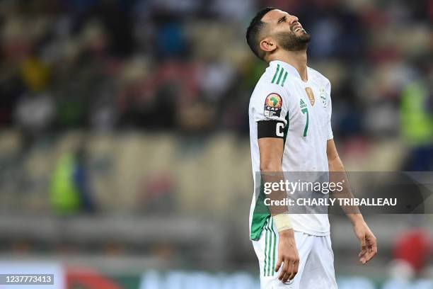 Algeria's forward Riyad Mahrez reacts after missing a free kick during the Group E Africa Cup of Nations 2021 football match between Algeria and...