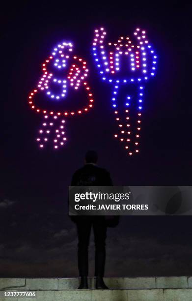 Drones form the image of a couple dancing Cueca, Chile's national dance, during a night light show, the first event of such kind held in the country,...