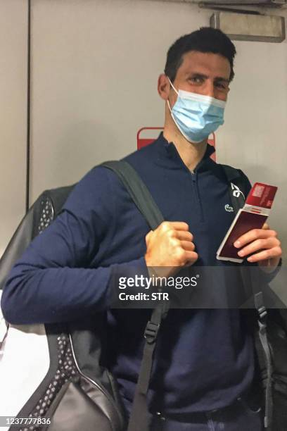 Serbia's tennis champion Novak Djokovic disembarks from a plane at the airport in Dubai on January 17 after losing a legal battle in Australia on...