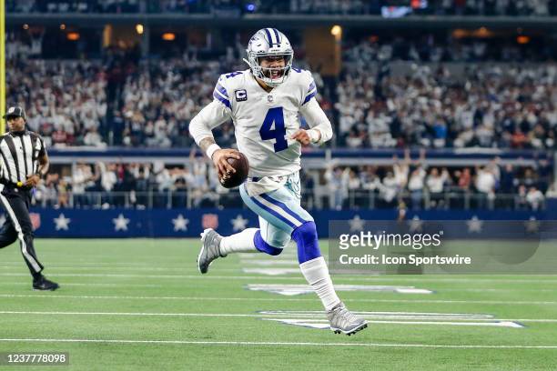 Dallas Cowboys quarterback Dak Prescott runs towards the end zone for a touchdown during the NFC Wild Card game between the Dallas Cowboys and the...
