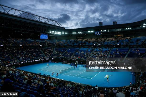 The crowd watches as Germany's Alexander Zverev hits a return against Germany's Daniel Altmaier during their men's singles match on day one of the...