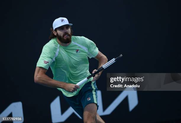 Reilly Opelka of the USA in action against Kevin Anderson of South Africa in their first round singles match during the 2022 Australian Open at...