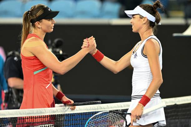 Spain's Paula Badosa shakes hands with Australia's Ajla Tomljanovic after their women's singles match on day one of the Australian Open tennis...