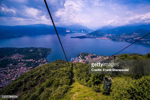 Aerial view on Laveno and Lake Maggiore from the cable car to Sasso del Ferro, surrounding mountains in the distance.