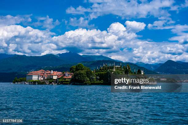 View to the island Isola Bella and its Italianate garden over Lake Maggiore, surrounding mountains in the distance.