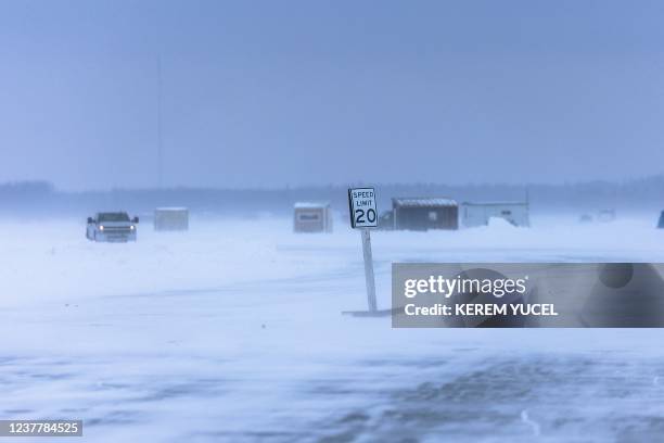 Twenty miles speed limit traffic sign is seen on The Northwest Angle ice road at Lake of the Woods, between Warroad and Angle Inlet, Minnesota, on...