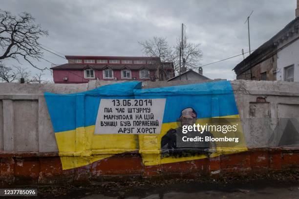 Mural commemorating a partisan fighter, killed during fighting in June 2014, in Mariupol, Ukraine, on Sunday, Jan. 16, 2022. Despite a stuttering...