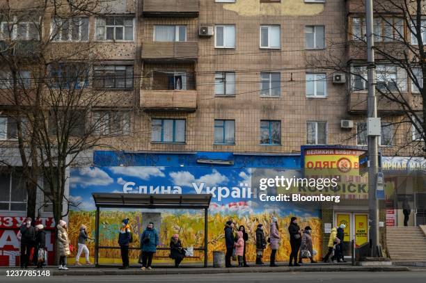 Bus stop next to a billboard reading "One Ukraine" in Mariupol, Ukraine, on Sunday, Jan. 16, 2022. Despite a stuttering diplomatic track and a large...