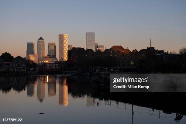 View of the Docklands area, Canary Wharf and financial district across Shadwell Basin and via the Brunel bridge in Wapping on 13th January 2022 in...