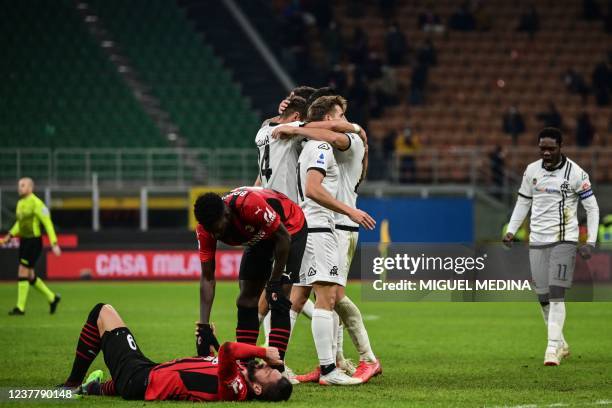 Spezia's Ghanaian forward Emmanuel Gyasi and teammates celebrates after scoring a last second winning goal, as AC Milan's French midfielder Tiemoue...