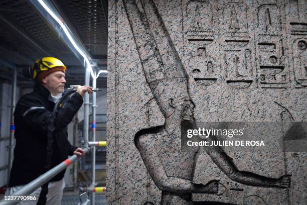 Restorer works on the Obelisk of Luxor, being restored, on the Place de la Concorde in Paris, on January 17, 2022.